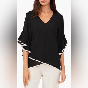 Beautiful blouse ruffled sleeves black with white trim.